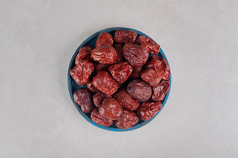 dried indian jujube berries wooden platter